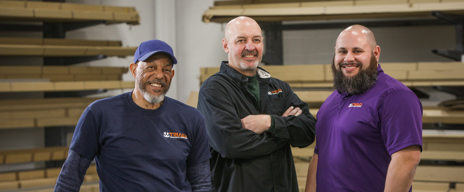 Three smiling Triad employees