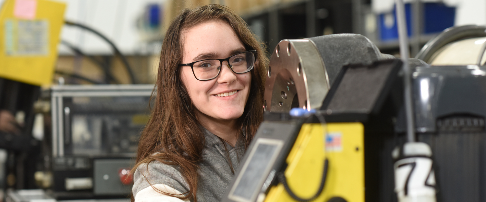 Triad employee crimping a hose